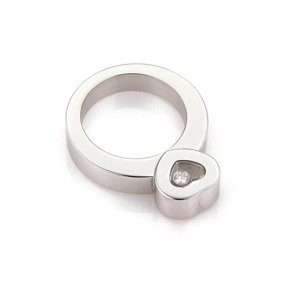 Chopard Happy Diamond 18k White Gold Heart Ring with Floating Diamond: Chopard Happy Diamond 18k White Gold Heart Ring with Floating Diamond Presenting an exquisite Chopard Happy Diamond ring, a stunning piece crafted from 18k white gold. This authentic ring features a p