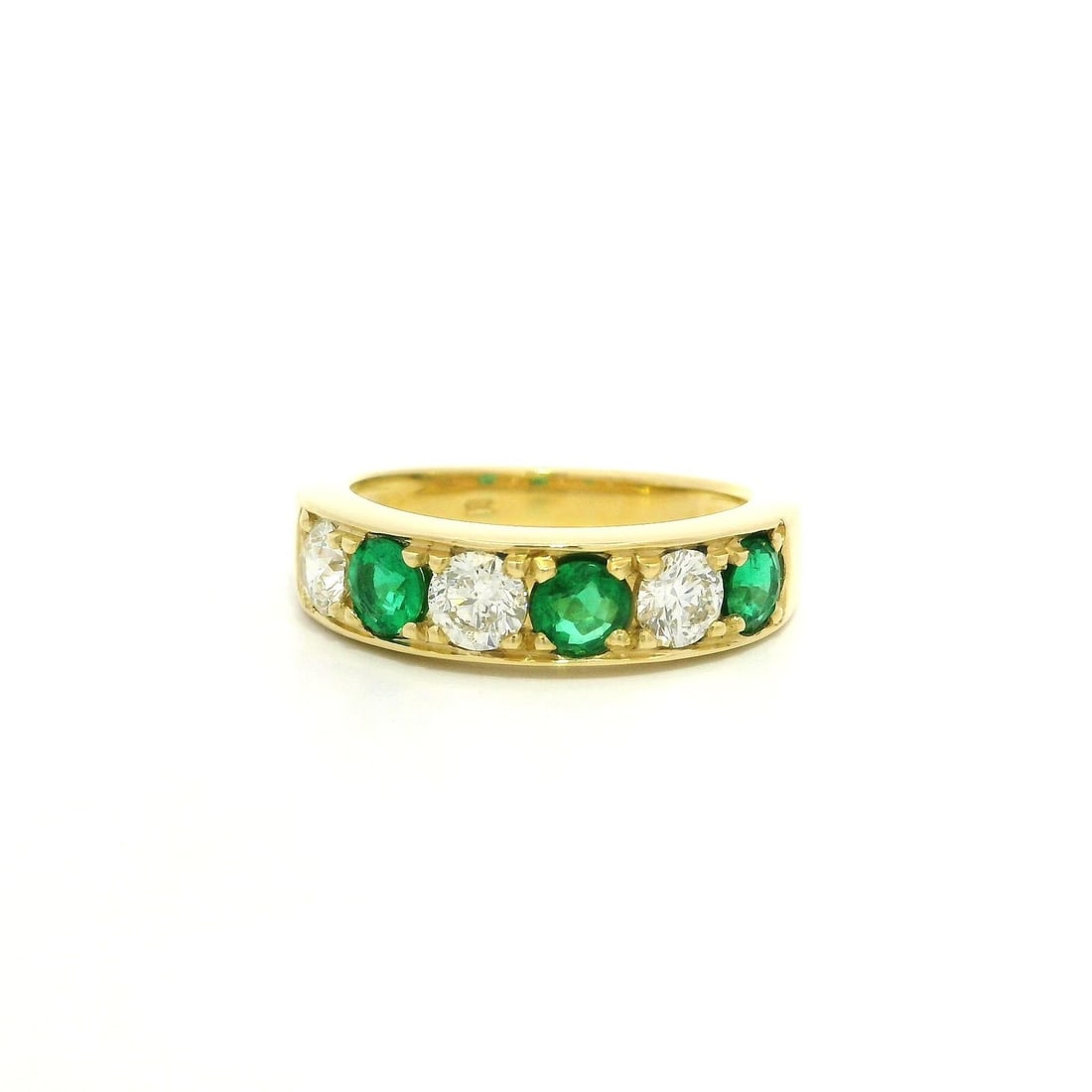 18k Yellow Gold Emerald Diamond Heavy Band Ring 1.46ctw: 18k Yellow Gold Emerald Diamond Heavy Band Ring 1.46ctw This exquisite 18k Yellow Gold Band Ring features a stunning combination of natural emeralds and diamonds. The ring showcases three brilliant cu