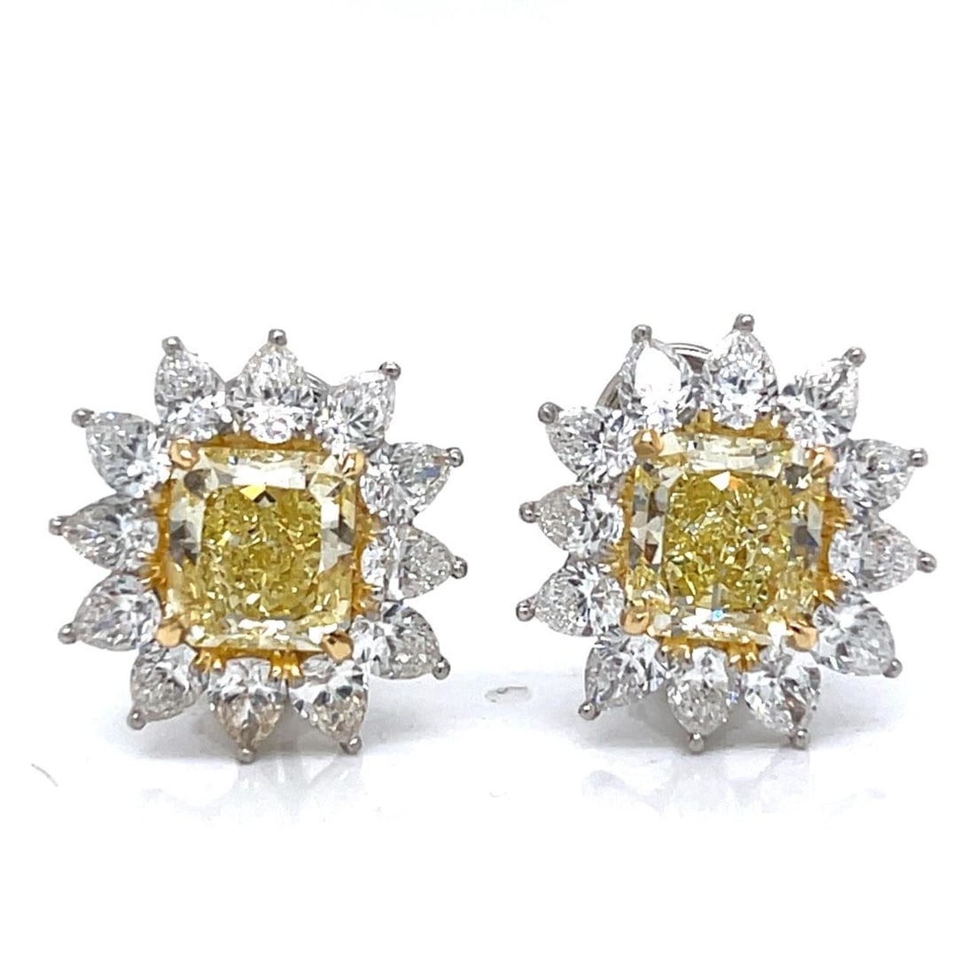 GIA Certified 5.34 Ct. Fancy Yellow Diamond Earrings in Platinum & 18K White Gold: GIA Certified 5.34 Ct. Fancy Yellow Diamond Earrings in Platinum & 18K White Gold These exquisite earrings are crafted in a combination of platinum and 18K white gold, featuring two stunning GIA certi