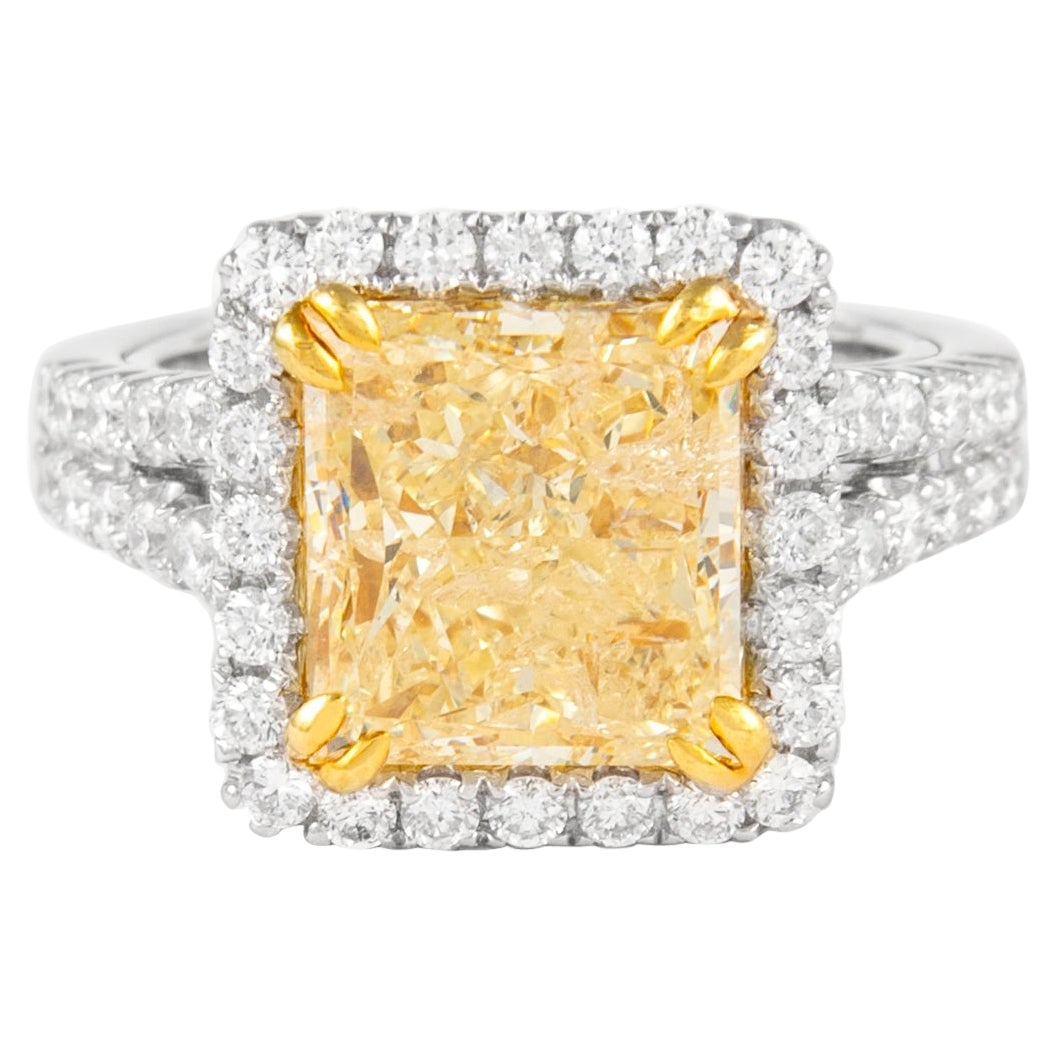4.50ct Fancy Intense Yellow Diamond Halo Ring 18k Gold EGL Certified: 4.50ct Fancy Intense Yellow Diamond Halo Ring 18k Gold EGL Certified This exquisite ring features a stunning 4.50 ct Fancy Intense Yellow radiant cut diamond at its center, surrounded by a halo of 82