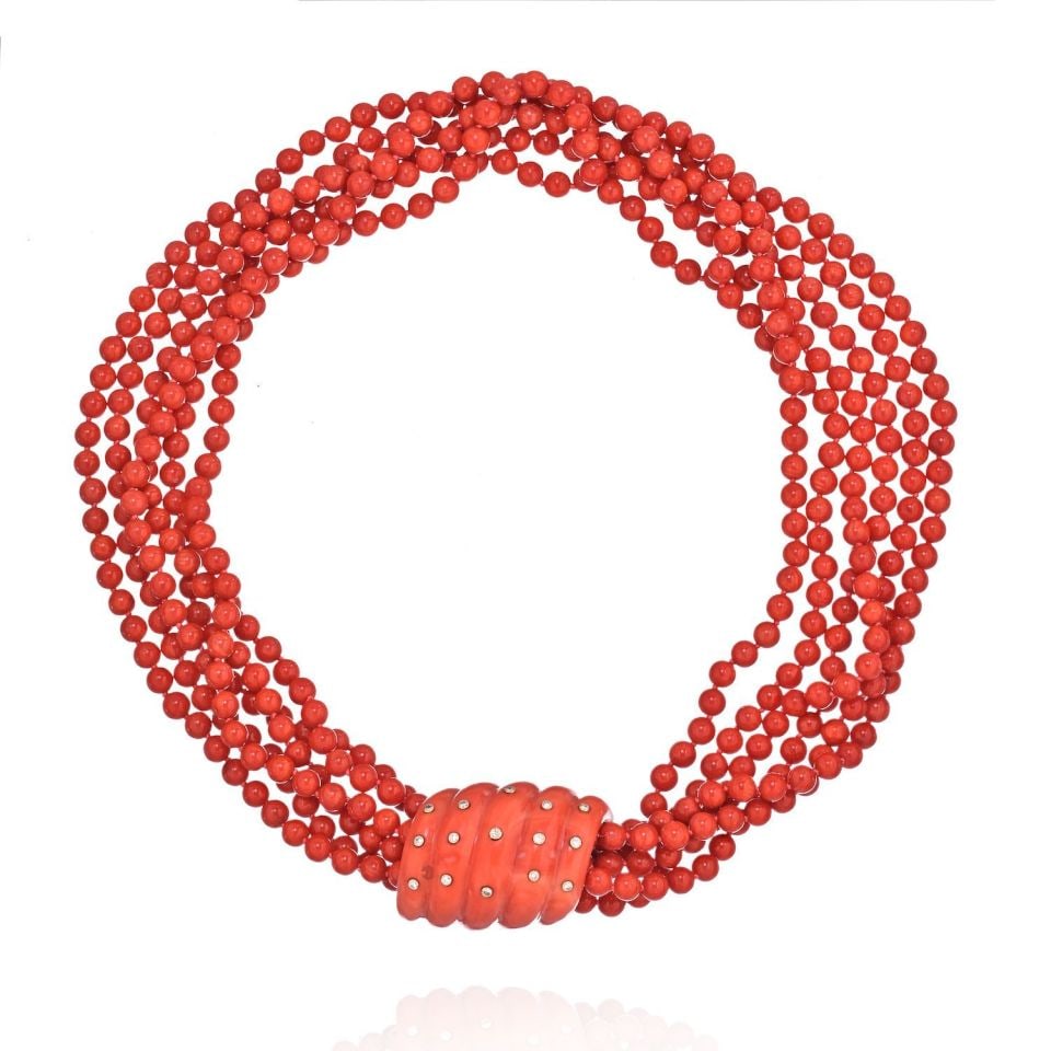 Seaman Schepps 18K Yellow Gold Coral Diamond Necklace 6 Strands: Seaman Schepps 18K Yellow Gold Coral Diamond Necklace 6 Strands This exquisite Seaman Schepps necklace features six strands of vibrant coral beads, elegantly combined with a fluted coral and a round b