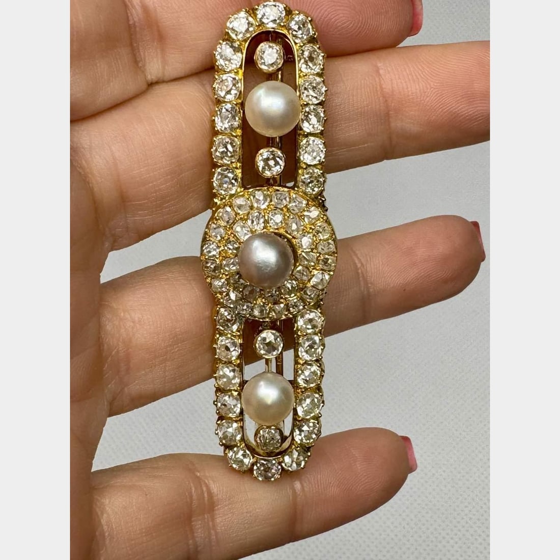 Antique French 18K Gold Brooch with 11.50 Ct Diamonds and Pearls: Antique French 18K Gold Brooch with 11.50 Ct Diamonds and Pearls This exquisite Antique French brooch is crafted from 18K gold and features a stunning arrangement of 63 Old Mine Diamonds, totaling app