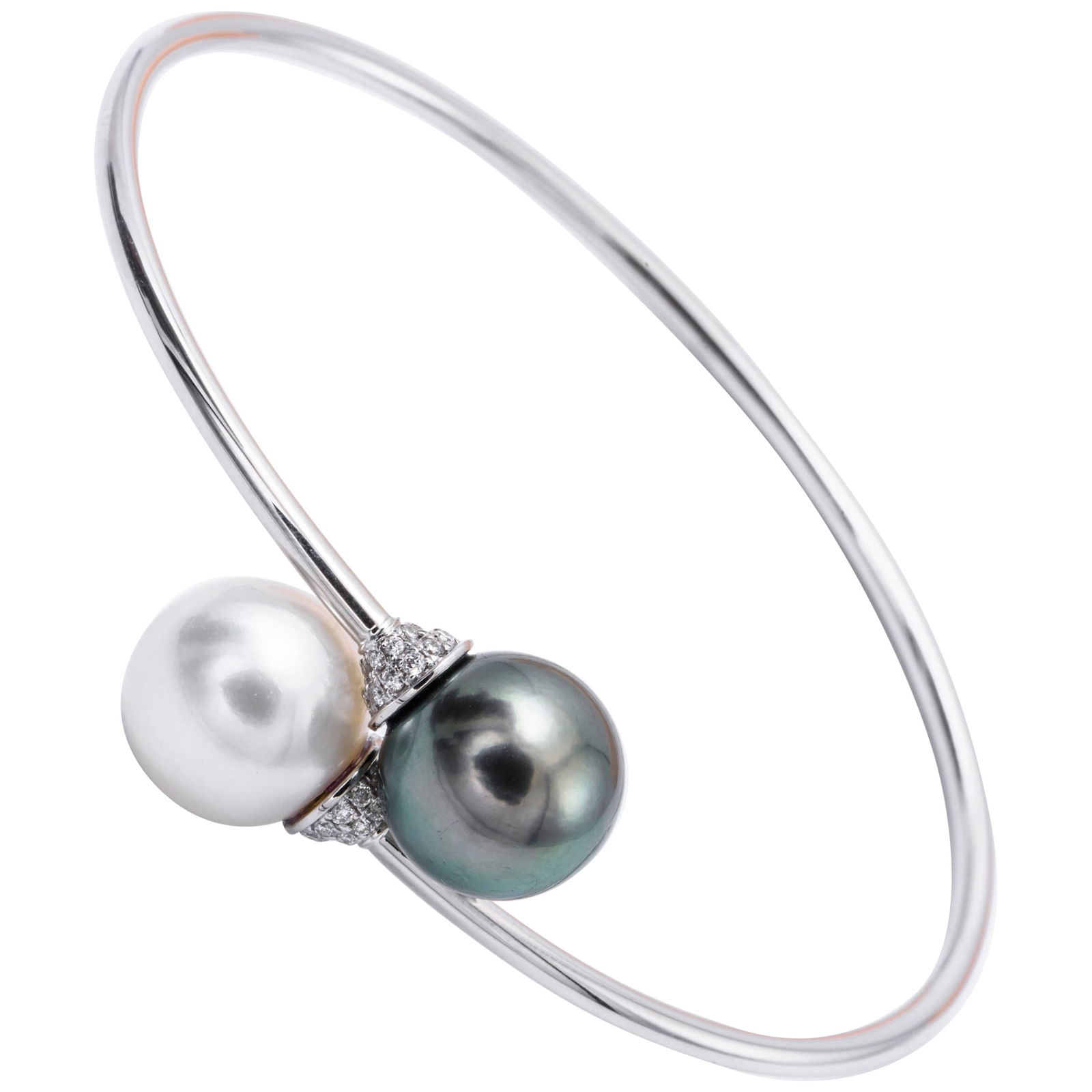 Harbor Diamonds 18K White Gold Pearl Diamond Bypass Bangle: Harbor Diamonds 18K White Gold Pearl Diamond Bypass Bangle This exquisite bypass bangle showcases a stunning combination of South Sea and Tahitian pearls, elegantly complemented by 42 round-cut diamon