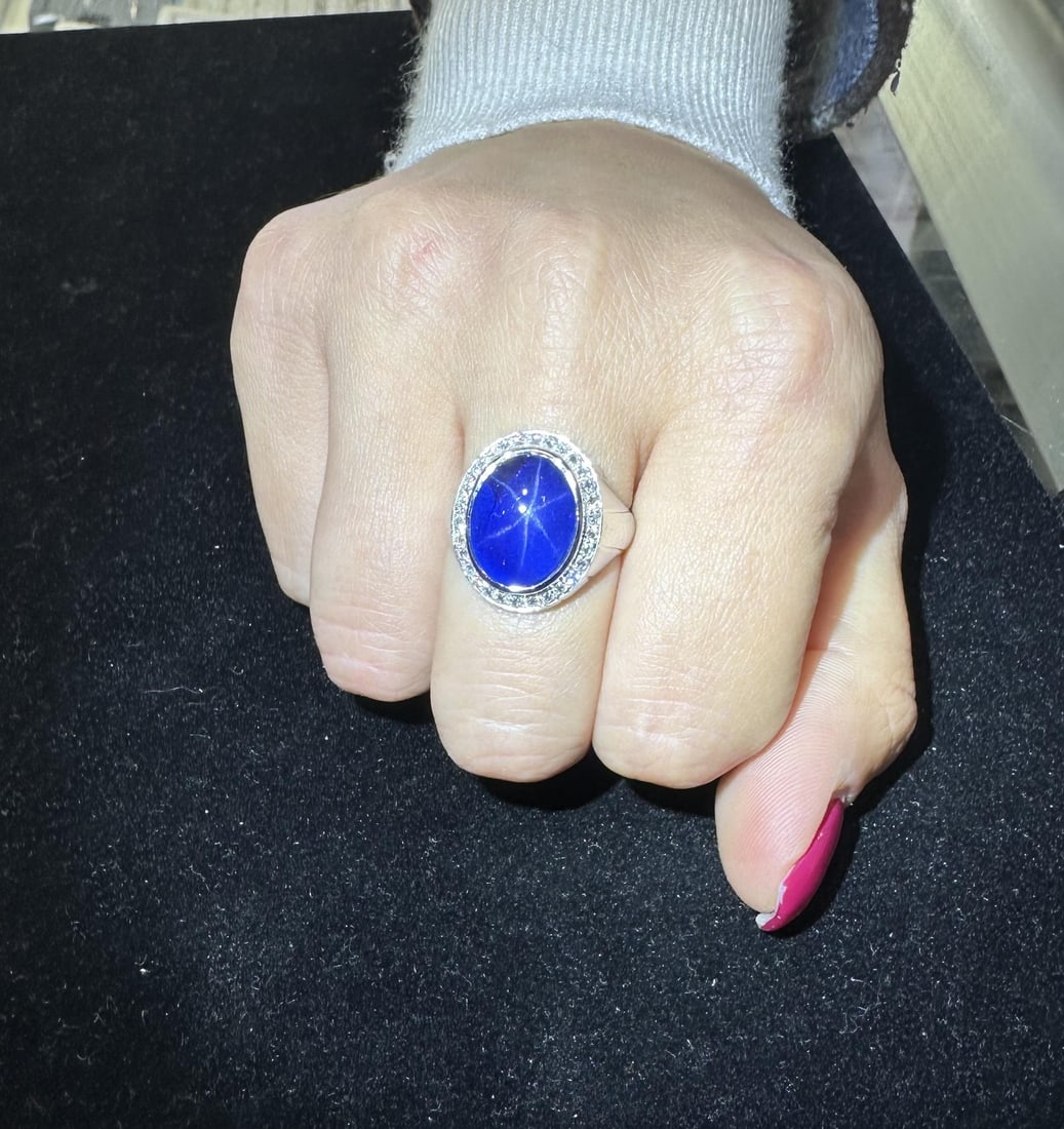 Platinum GIA 13.65ctw Blue Star Sapphire & Diamond Ring: Platinum GIA 13.65ctw Blue Star Sapphire & Diamond Ring This exquisite Platinum GIA ring features a stunning 13.19ct natural blue star sapphire, elegantly set in a bezel with a captivating oval caboch