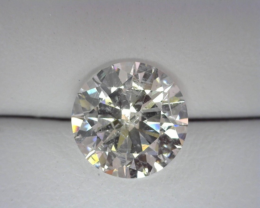 Loose Diamond - ROUND 1.41ct G I1: Loose Diamond - ROUND 1.41ct G I1 Source: Natural Shape: ROUND Carats: 1.41 Color: G Clarity: I1 Certification: OTHER The Diamond Depot Guarantee: All items in this auction are guaranteed to be 100% a