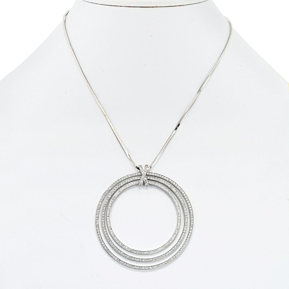 Cartier 18K White Gold Diamond Pave Tiered Ring Pendant Necklace: Cartier 18K White Gold Diamond Pave Tiered Ring Pendant Necklace This exquisite Cartier necklace showcases a stunning design featuring three tiered rings that are pave set with 315 brilliant diamonds,