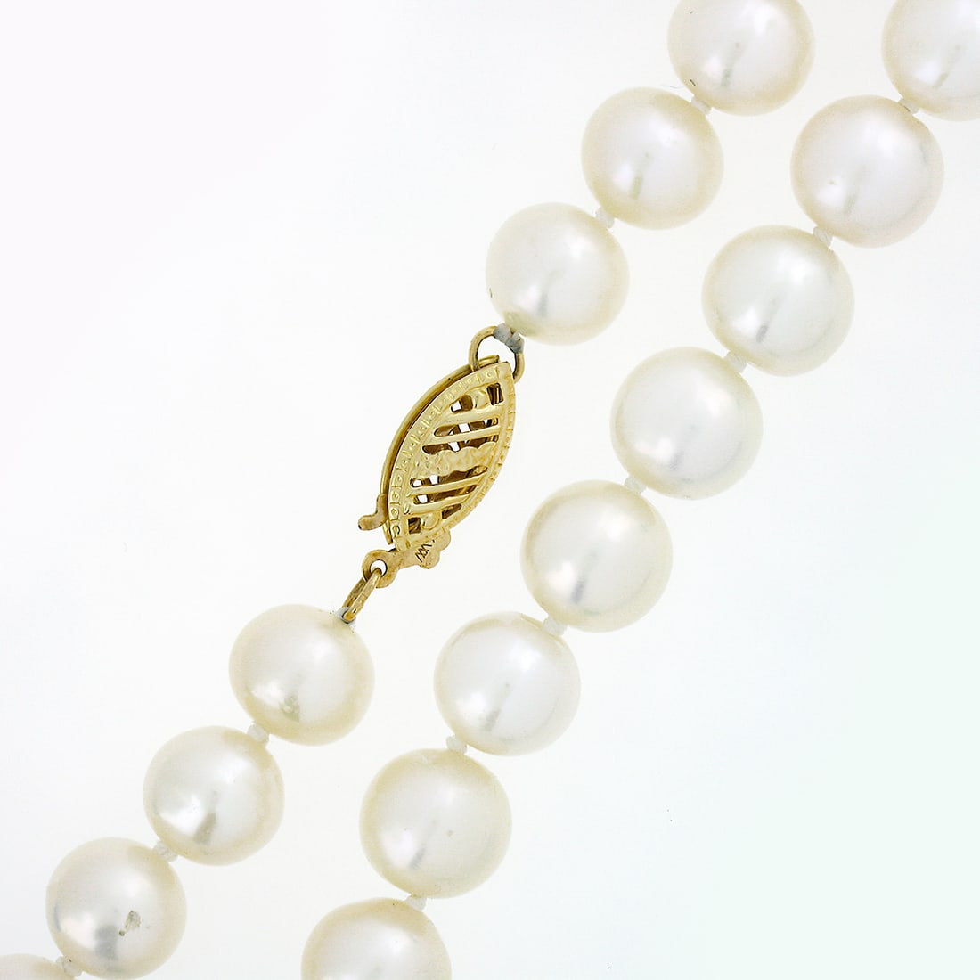 Elegant Estate 14k Yellow Gold Filigree Pearl Strand Necklace: Elegant Estate 14k Yellow Gold Filigree Pearl Strand Necklace This exquisite estate necklace features a stunning strand of 57 genuine cultured pearls, each semi-round in shape with a pure white color