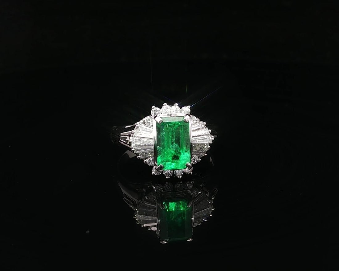 GIA Certified 2.02ct Colombian Emerald Diamond Ring in Platinum: GIA Certified 2.02ct Colombian Emerald Diamond Ring in Platinum This exquisite cocktail ring features a stunning natural Colombian emerald, prong set in solid platinum. The emerald showcases a long oc