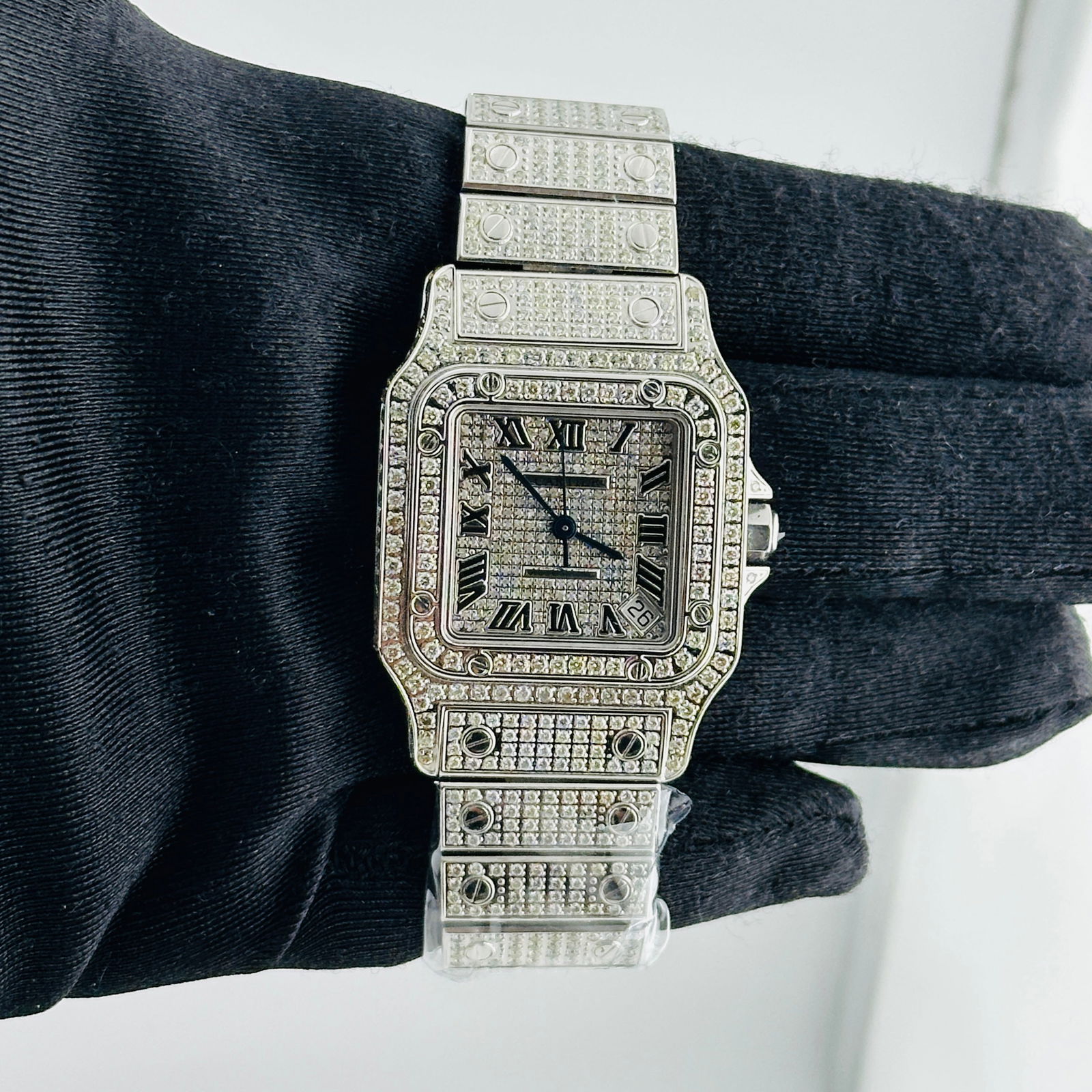 Diamond Dial Santos Galbee XL Watch Ref 2823 by Cartier: Diamond Dial Santos Galbee XL Watch Ref 2823 by Cartier This Cartier Santos Galbee XL watch features a diamond-set dial, bezel, and bracelet, offering a luxurious and elegant appearance. Designed as a
