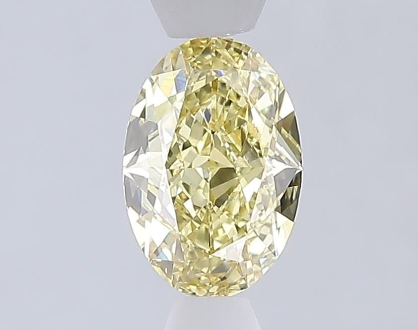Loose Diamond - OVAL 1.04ct Fancy Yellow VS1: Loose Diamond - OVAL 1.04ct Fancy Yellow VS1 Source: This is a real non-mined Diamond that has been grown in a lab Shape: OVAL Carats: 1.04 Color: Fancy Yellow Certification: IGI Video: