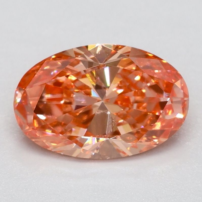 Loose Diamond - OVAL 0.7ct Fancy Vivid Orangey Pink SI2: Loose Diamond - OVAL 0.7ct Fancy Vivid Orangey Pink SI2 Source: This is a real non-mined Diamond that has been grown in a lab Shape: OVAL Carats: 0.7 Color: Fancy Vivid Orangey Pink Certification: NON