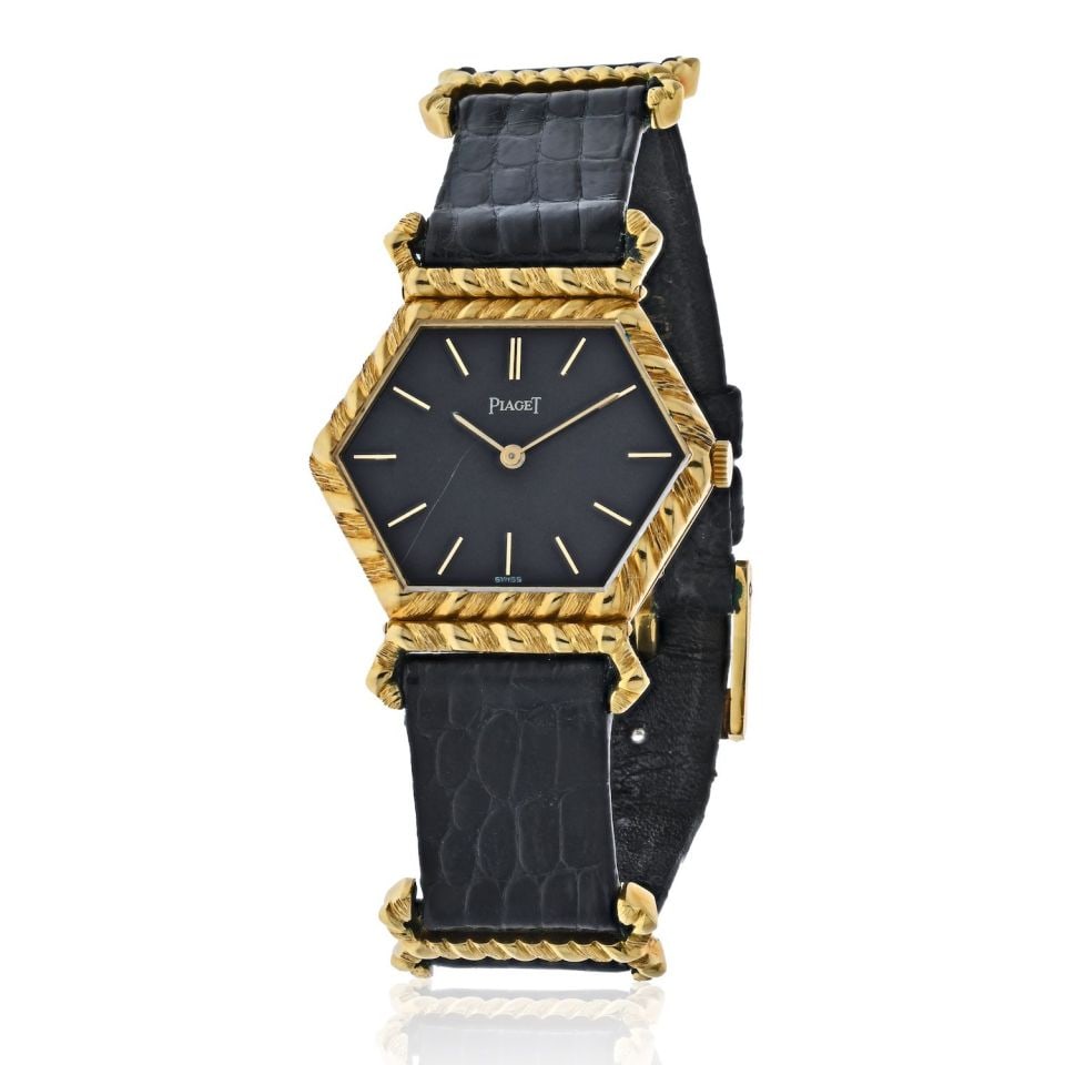 Piaget 18K Yellow Gold Hexagonal Vintage Ladies Watch 9559 D: Piaget 18K Yellow Gold Hexagonal Vintage Ladies Watch 9559 D This exquisite Piaget vintage ladies watch is a stunning piece crafted in 18K yellow gold, showcasing a unique hexagonal dial that reflects