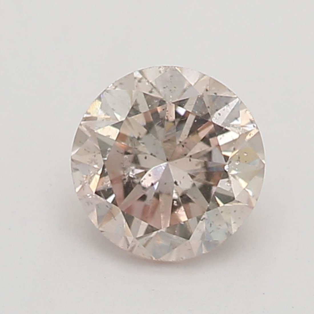 Loose Diamond - ROUND 0.28ct Light Orangey Pink SI2: Loose Diamond - ROUND 0.28ct Light Orangey Pink SI2 Source: Natural Shape: ROUND Carats: 0.28 Color: Light Orangey Pink Certification: NONE Video: