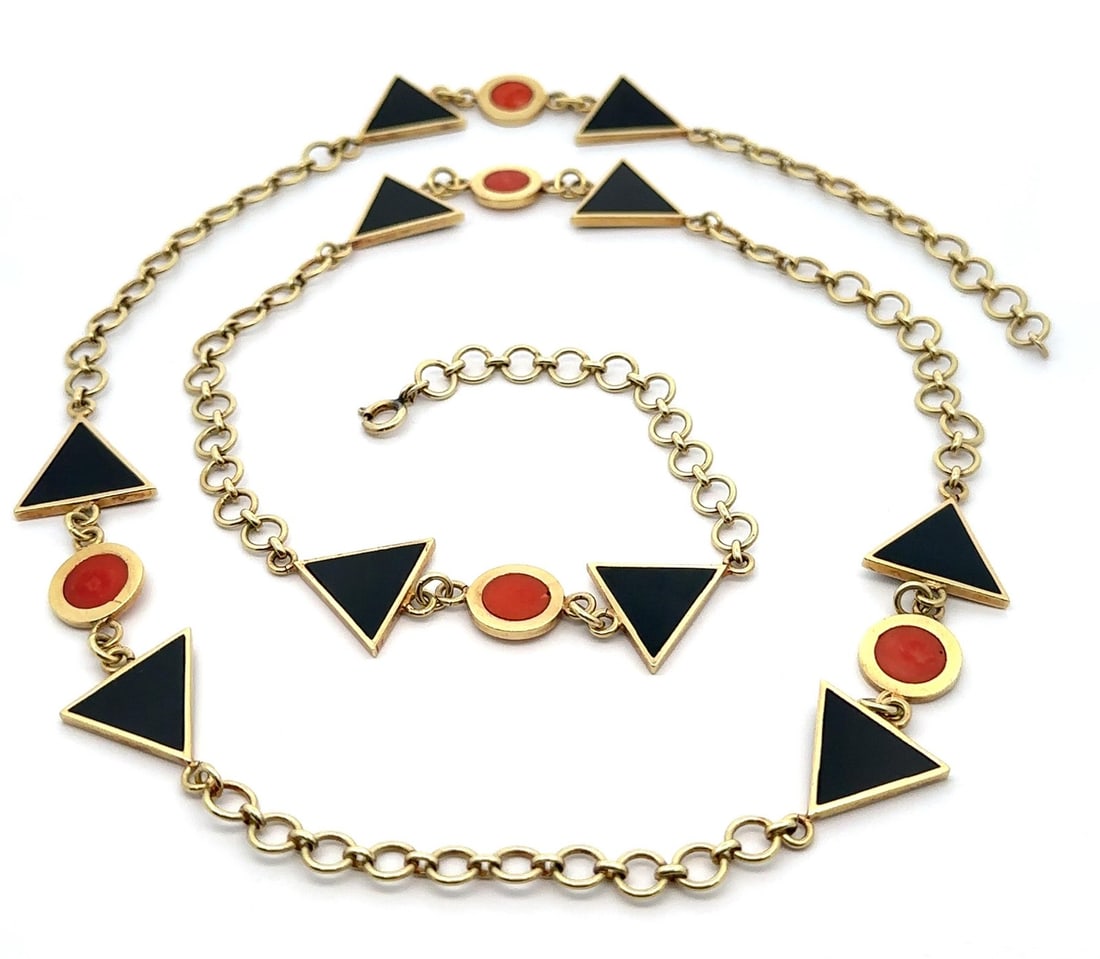 Handmade 14k Yellow Gold 30 Inch Coral and Black Onyx Station Necklace: Handmade 14k Yellow Gold 30 Inch Coral and Black Onyx Station Necklace This exquisite handmade necklace features a stunning combination of natural black onyx and coral, meticulously crafted in solid 1