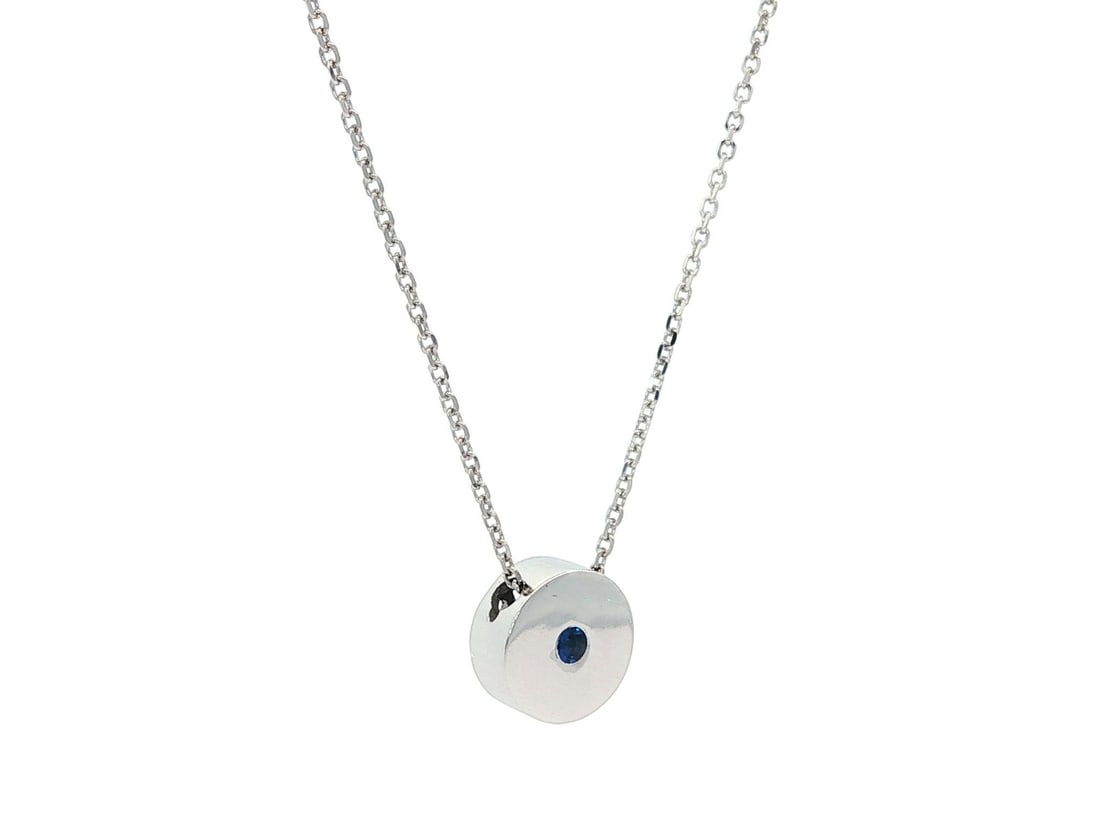 14k White Gold Blue Sapphire Round Disk Slide Pendant Necklace: 14k White Gold Blue Sapphire Round Disk Slide Pendant Necklace This exquisite necklace features a stunning round disk slide pendant crafted from solid 14k white gold. The pendant showcases a natural g