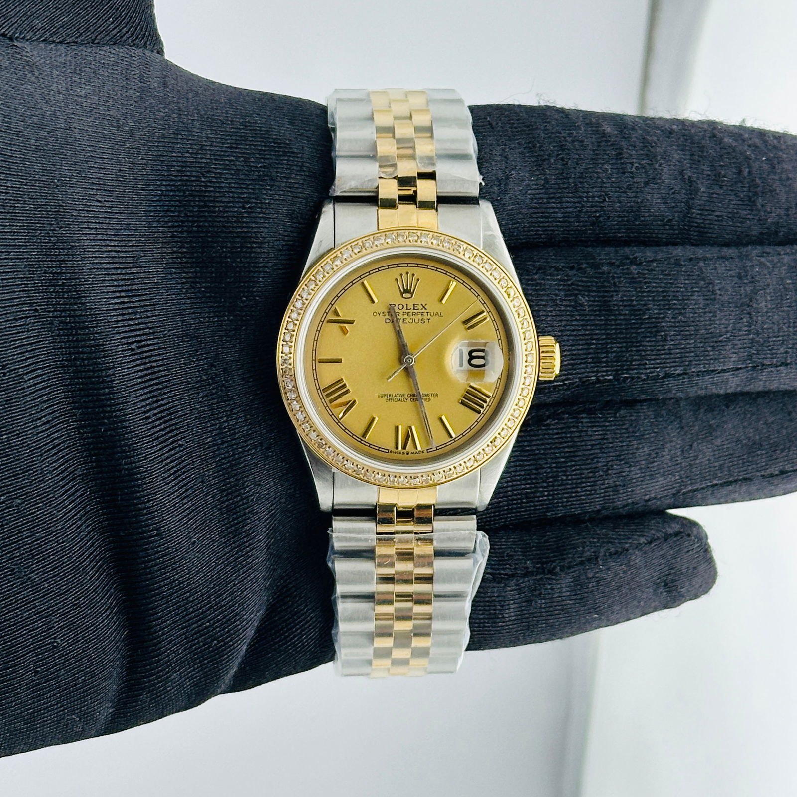 Aftermarket Champagne Roman Dial Datejust Ref 1601 on Jubilee Bracelet: Aftermarket Champagne Roman Dial Datejust Ref 1601 on Jubilee Bracelet This is a men's Rolex Datejust watch, reference 1601, featuring an aftermarket champagne Roman stick dial and an aftermarket Jubi