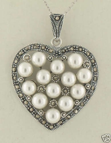 18 Inch Sterling Silver Heart Pendant Necklace with Pearl and Marcasite: 18 Inch Sterling Silver Heart Pendant Necklace with Pearl and Marcasite This exquisite 18" Sterling Silver necklace features a unique heart-shaped pendant adorned with a stunning cluster of 13 simulat