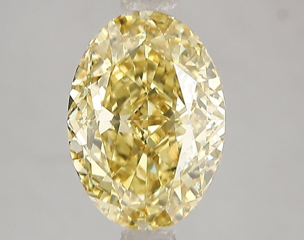 Loose Diamond - OVAL 3.05ct Fancy Vivid Yellow VS1: Loose Diamond - OVAL 3.05ct Fancy Vivid Yellow VS1 Source: This is a real non-mined Diamond that has been grown in a lab Shape: OVAL Carats: 3.05 Color: Fancy Vivid Yellow Certification: IGI Video: