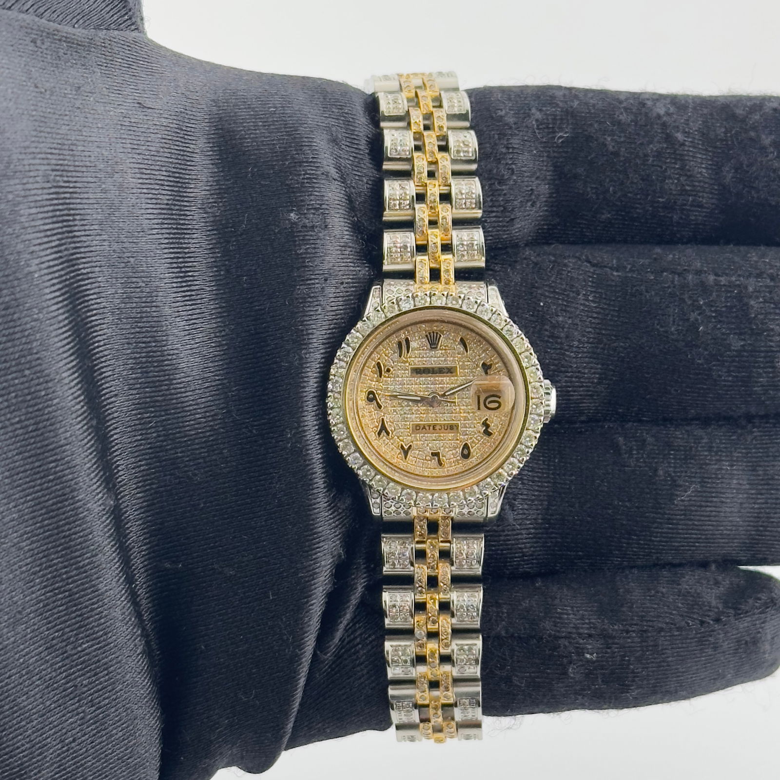 Iced Out Arabic Dial Ladies Watch Aftermarket Jubilee Ref 6516: Iced Out Arabic Dial Ladies Watch Aftermarket Jubilee Ref 6516 This Rolex Datejust features an iced out Arabic dial and a prong plated bezel, paired with an aftermarket Jubilee bracelet. Designed for