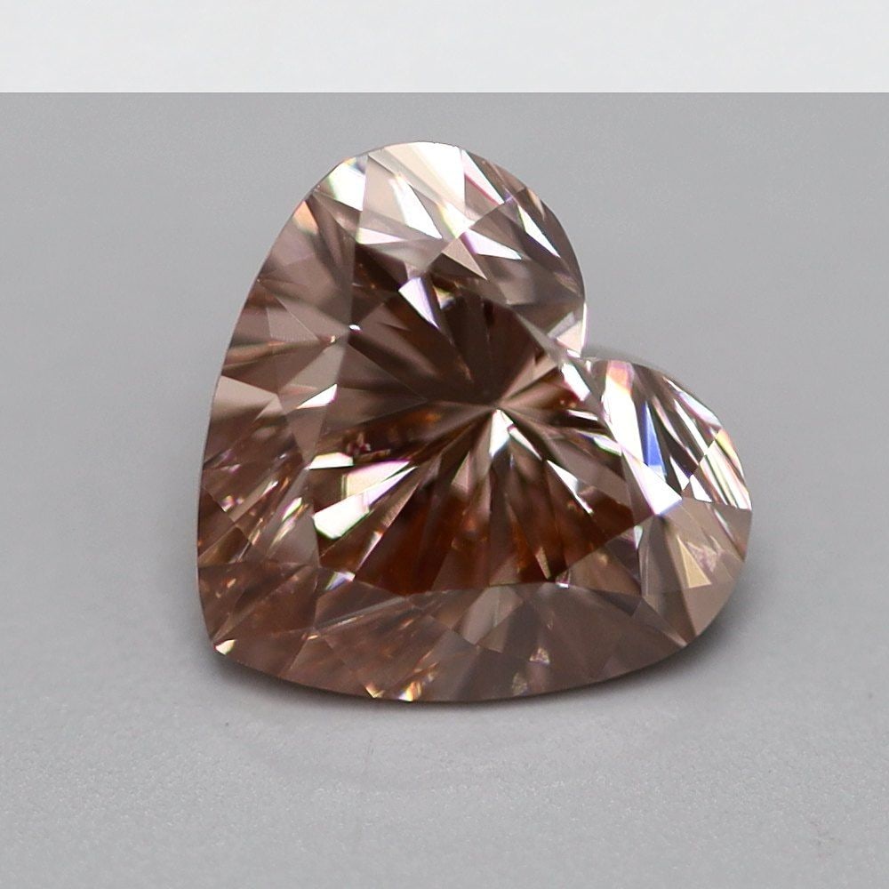 Loose Diamond - HEART 1.0ct Fancy Vivid Brownish Pink VS2: Loose Diamond - HEART 1.0ct Fancy Vivid Brownish Pink VS2 Source: This is a real non-mined Diamond that has been grown in a lab Shape: HEART Carats: 1.0 Color: Fancy Vivid Brownish Pink Certification: