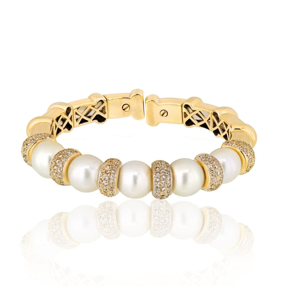 Bvlgari 18K White Gold Pearl Diamond Cuff Bracelet: Bvlgari 18K White Gold Pearl Diamond Cuff Bracelet This exquisite Bvlgari cuff bangle bracelet is crafted from luxurious 18K white gold and features stunning diamonds and pearls. With a total weight o