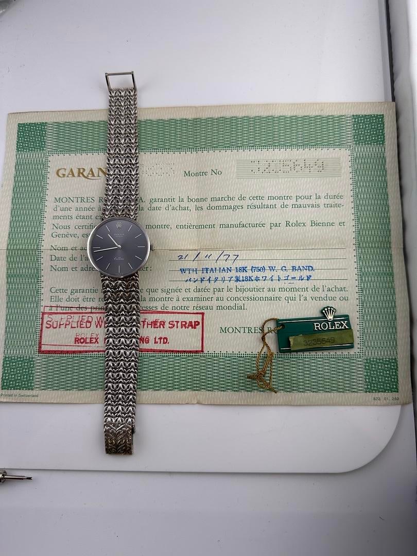 Ladies Rolex Cellini Ref 3833 Grey Dial Aftermarket White Gold Bracelet 1977 Papers: Ladies Rolex Cellini Ref 3833 Grey Dial Aftermarket White Gold Bracelet 1977 Papers This Rolex Cellini watch features a grey dial and an aftermarket white gold band. Designed for ladies, it is a 1977