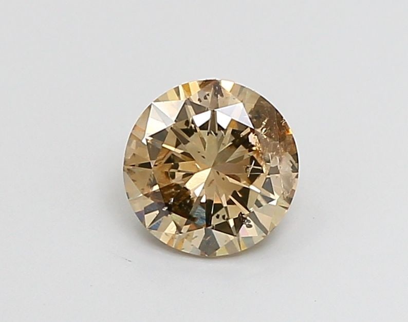 Loose Diamond - ROUND 0.96ct Fancy Brown I2: Loose Diamond - ROUND 0.96ct Fancy Brown I2 Source: Natural Shape: ROUND Carats: 0.96 Color: Fancy Brown Certification: NONE Video: Video Link The Diamond Depot Guarantee: All items in this auction