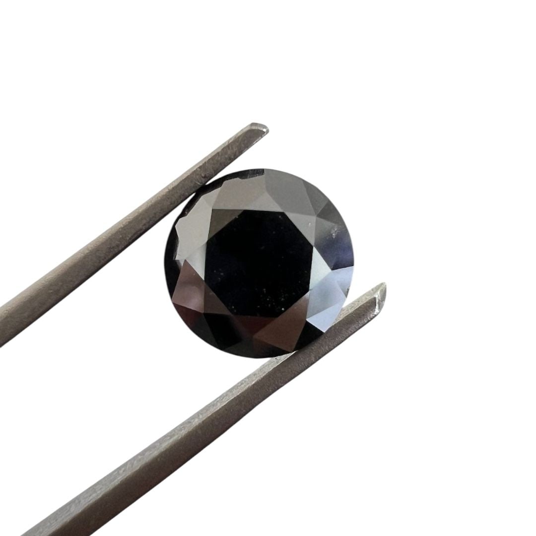 Loose Diamond - ROUND 1.8ct Fancy Black: Loose Diamond - ROUND 1.8ct Fancy Black Source: Natural Shape: ROUND Carats: 1.8 Color: Fancy Black Certification: GIA The Diamond Depot Guarantee: All items in this auction are guaranteed to be 100%