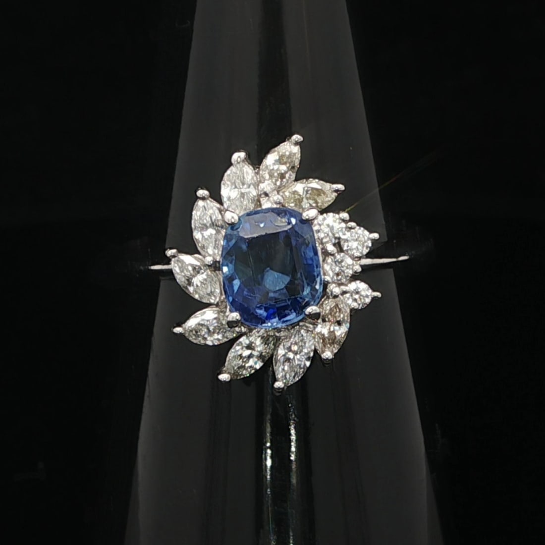 Platinum Swirl Ring with Cushion Blue Sapphire and Marquise Round Diamonds 2.38ctw: Platinum Swirl Ring with Cushion Blue Sapphire and Marquise Round Diamonds 2.38ctw This platinum cocktail ring features a natural old cushion cut sapphire with an exact carat weight of 1.51ct, display