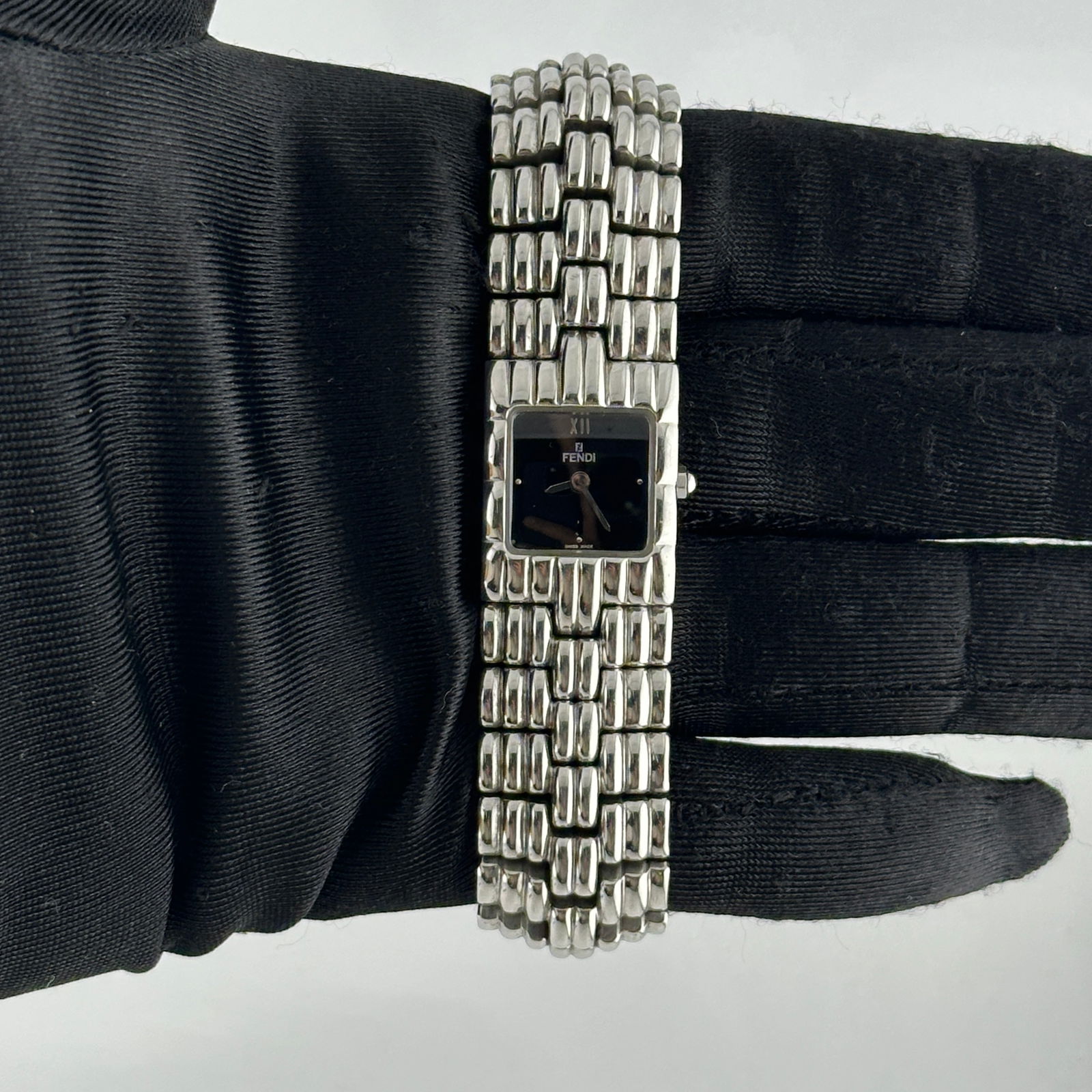 Fendi 680L Stainless Steel Watch with Black Dial 19mm: Fendi 680L Stainless Steel Watch with Black Dial 19mm This Fendi Orologi wristwatch features a black dial and stainless steel construction. The watch has a 19mm case and comes with 25 links on the bra