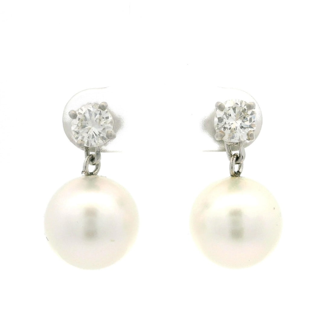 18k White Gold Pearl and Diamond Earrings Stud Dangle 1ctw: 18k White Gold Pearl and Diamond Earrings Stud Dangle 1ctw Elevate your jewelry collection with these exquisite 18k White Gold earrings featuring natural cultured pearls and sparkling diamonds. These