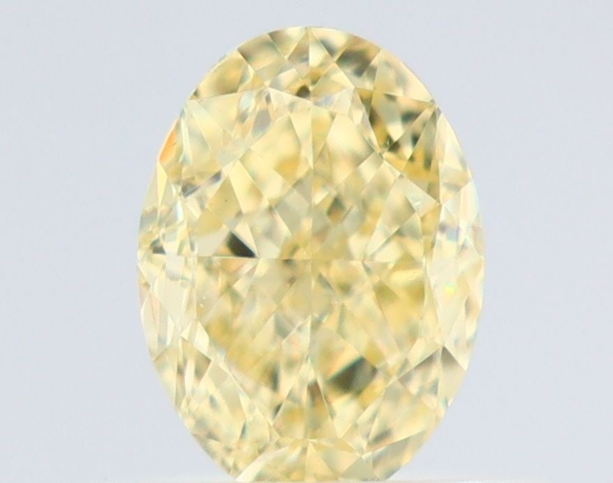 Loose Diamond - OVAL 0.65ct Fancy Yellow VVS1: Loose Diamond - OVAL 0.65ct Fancy Yellow VVS1 Source: Natural Shape: OVAL Carats: 0.65 Color: Fancy Yellow Certification: GIA Video: