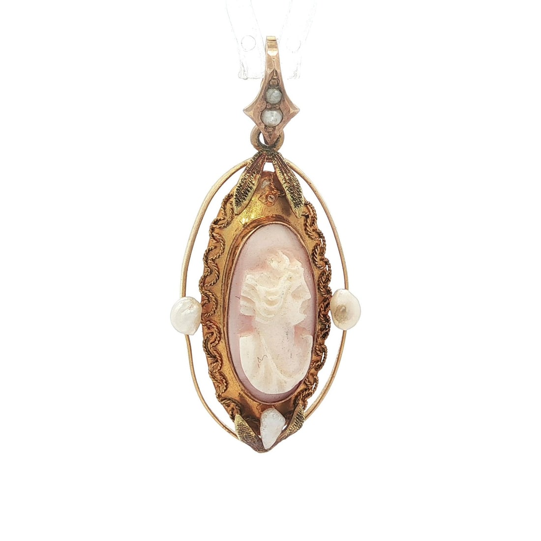 Antique Art Nouveau 10k Gold Cameo Coral Pendant with Seed Pearls: Antique Art Nouveau 10k Gold Cameo Coral Pendant with Seed Pearls This exquisite Antique Art Nouveau pendant showcases a beautifully carved cameo of coral, elegantly framed in solid 10k yellow gold. T