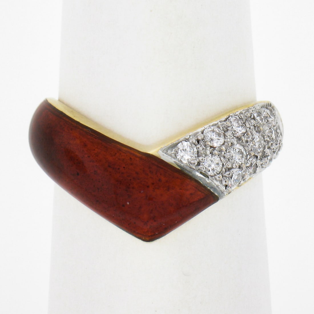 14k Yellow Gold Chevron Stackable Band Ring with 0.28ctw Diamonds and Red Enamel: 14k Yellow Gold Chevron Stackable Band Ring with 0.28ctw Diamonds and Red Enamel This exquisite 14k Yellow Gold band ring features a stunning design with a vibrant red enamel V chevron accent and is a