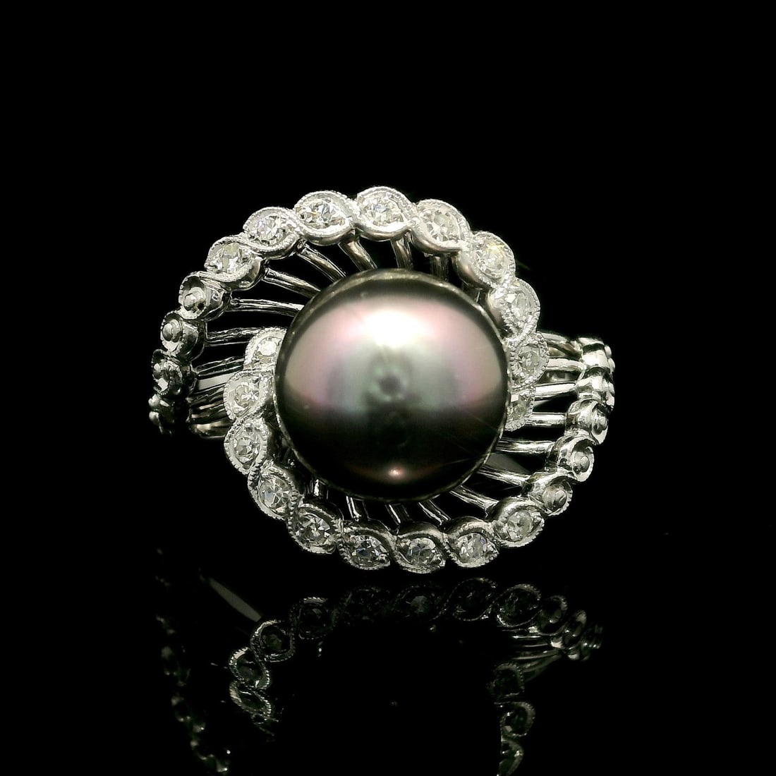 Vintage White Gold Cocktail Ring with Tahitian Pearl and Diamond Spray: Vintage White Gold Cocktail Ring with Tahitian Pearl and Diamond Spray This exquisite Vintage Cocktail Ring features a stunning genuine Tahitian pearl, showcasing a round shape and a beautiful gray co