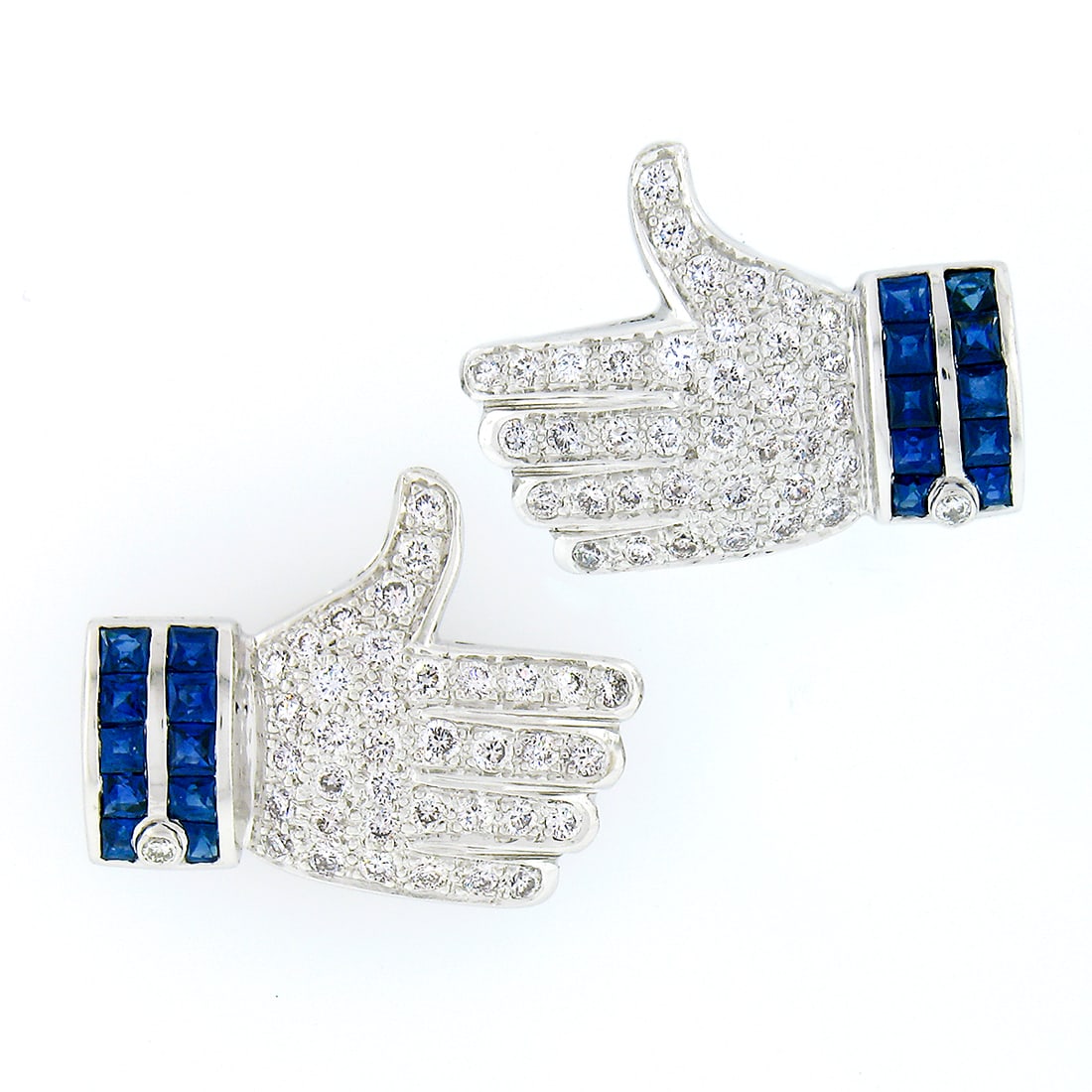 18k White Gold 2.0ctw Sapphire Diamond Thumbs Up Stud Earrings: 18k White Gold 2.0ctw Sapphire Diamond Thumbs Up Stud Earrings Elevate your jewelry collection with these stunning 18k White Gold Thumbs Up "Like" Statement Earrings. Exquisitely crafted, these earrin