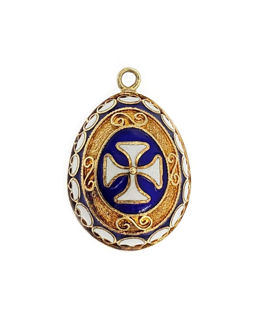 Vintage 14k Yellow Gold Enamel Egg Cross Pendant Charm: Vintage 14k Yellow Gold Enamel Egg Cross Pendant Charm This exquisite vintage charm or pendant showcases a beautifully crafted egg shape made from 14k yellow gold. It features striking blue and white