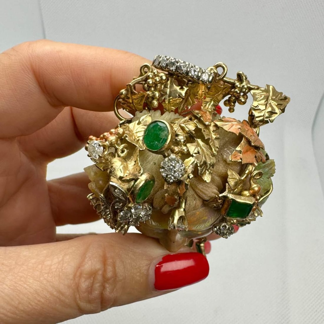 14K Yellow Gold Opal Diamond Emerald Brooch 3.00 Ct Diamonds 2.00 Ct Emeralds: 14K Yellow Gold Opal Diamond Emerald Brooch 3.00 Ct Diamonds 2.00 Ct Emeralds This exquisite brooch features a stunning combination of 14K yellow gold, carved opal, diamonds, and emeralds. It is adorn