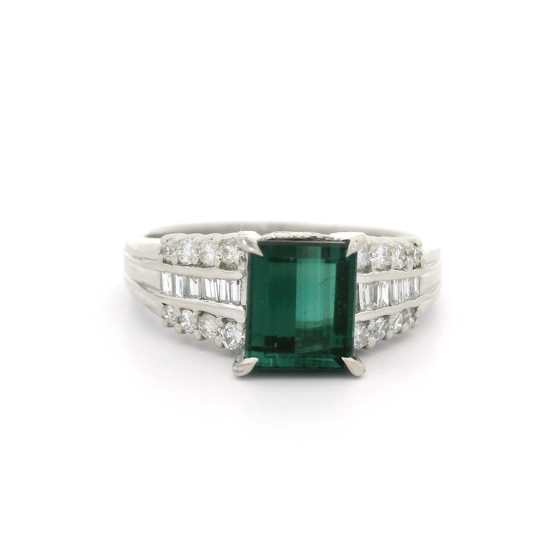 Vintage Platinum 1.99ctw Green Tourmaline Diamond Accent Cocktail Ring: Vintage Platinum 1.99ctw Green Tourmaline Diamond Accent Cocktail Ring This vintage cocktail ring features a stunning natural green tourmaline with a rectangular step cut, elegantly prong set and weig