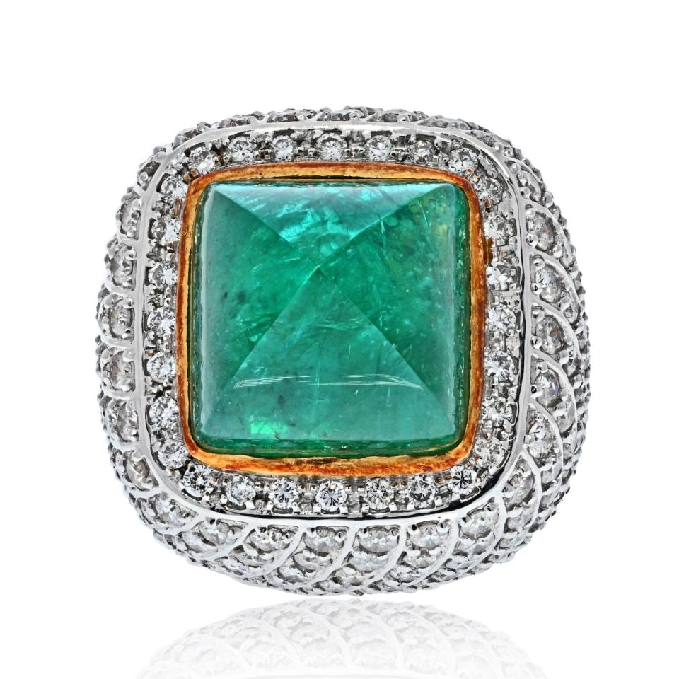 18K Two Tone 38 Carat Sugarloaf Emerald Diamond Cocktail Ring: 18K Two Tone 38 Carat Sugarloaf Emerald Diamond Cocktail Ring This exquisite cocktail ring features an impressive 38 carat sugarloaf green emerald that is sure to captivate attention. The stone showca