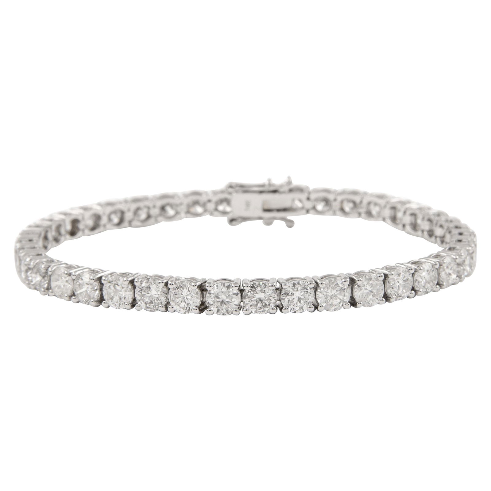 12.19ct Diamond Tennis Bracelet in 14k White Gold: 12.19ct Diamond Tennis Bracelet in 14k White Gold This exquisite and timeless diamond tennis bracelet features 37 round brilliant diamonds totaling 12.19 carats. Crafted from 14k white gold, it showca