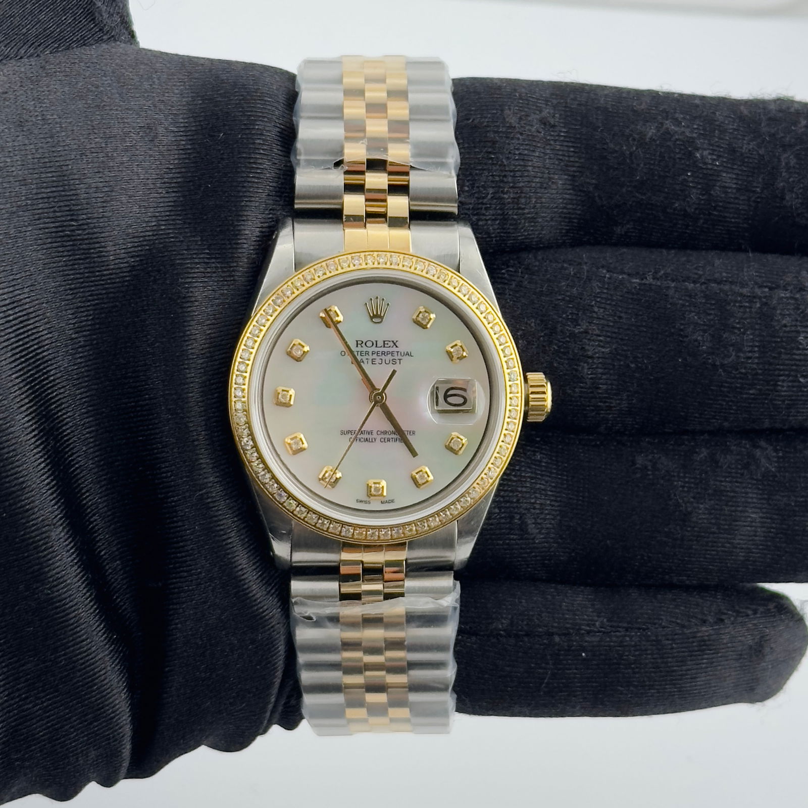 Rolex 1603 Datejust Mens Watch Aftermarket White MOP Diamond Dial Jubilee: Rolex 1603 Datejust Mens Watch Aftermarket White MOP Diamond Dial Jubilee This Rolex Datejust features an after-market white mother-of-pearl diamond dial and a pave plated diamond bezel. The watch inc
