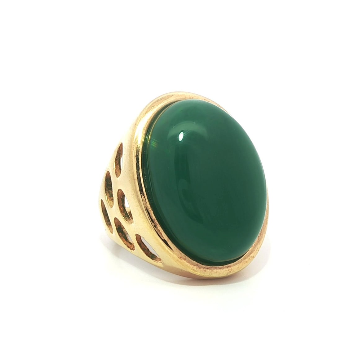Gold Tone Full Finger Ring with Large Green Cabochon Stone: Gold Tone Full Finger Ring with Large Green Cabochon Stone This stunning gold tone full finger ring showcases a large oval cabochon green stone, beautifully bezel set in an open work design. Crafted f