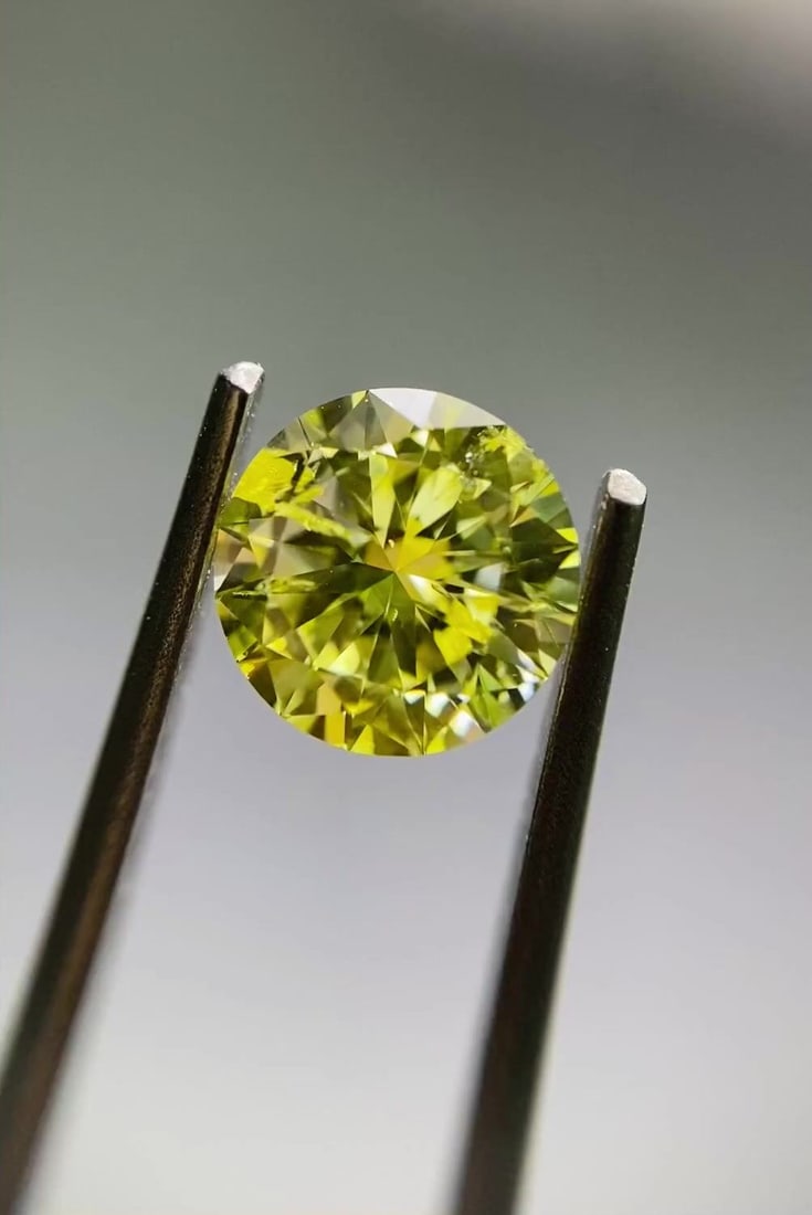 Loose Diamond - ROUND 0.7ct Fancy Intense Yellow I2: Loose Diamond - ROUND 0.7ct Fancy Intense Yellow I2 Source: Natural Shape: ROUND Carats: 0.7 Color: Fancy Intense Yellow Certification: GIA Video: