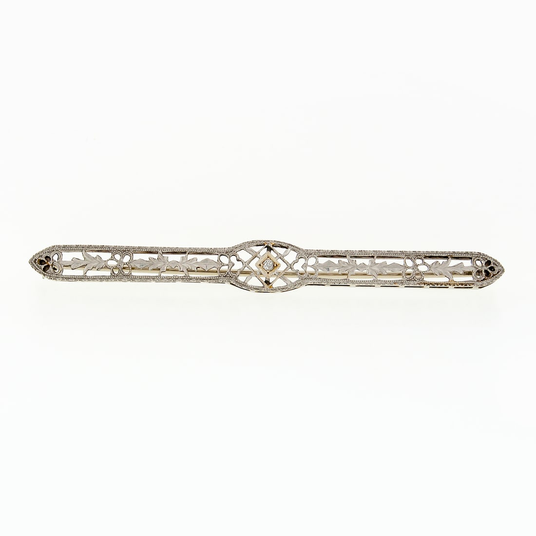 Antique Art Deco 14k White Gold Diamond Filigree Bar Brooch: Antique Art Deco 14k White Gold Diamond Filigree Bar Brooch This exquisite Antique Art Deco brooch is crafted from solid 14k white gold, showcasing an elegant open filigree design complemented by fine
