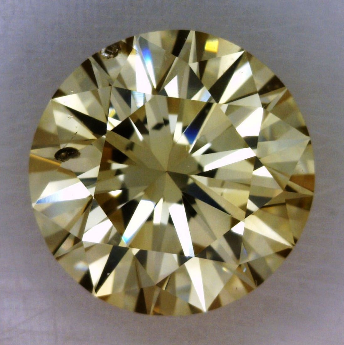 Loose Diamond - ROUND 0.97ct Fancy Light Brownish Yellow SI2: Loose Diamond - ROUND 0.97ct Fancy Light Brownish Yellow SI2 Source: Natural Shape: ROUND Carats: 0.97 Color: Fancy Light Brownish Yellow Certification: GIA The Diamond Depot Guarantee: All items in t