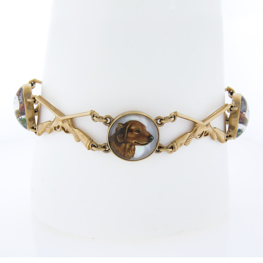 Vintage 14K Gold Hand Painted Dog & Pheasant Hunting Bracelet: Vintage 14K Gold Hand Painted Dog & Pheasant Hunting Bracelet This exquisite vintage bracelet showcases a unique hand-painted reverse intaglio design featuring a hunting dog and flying pheasants, comp