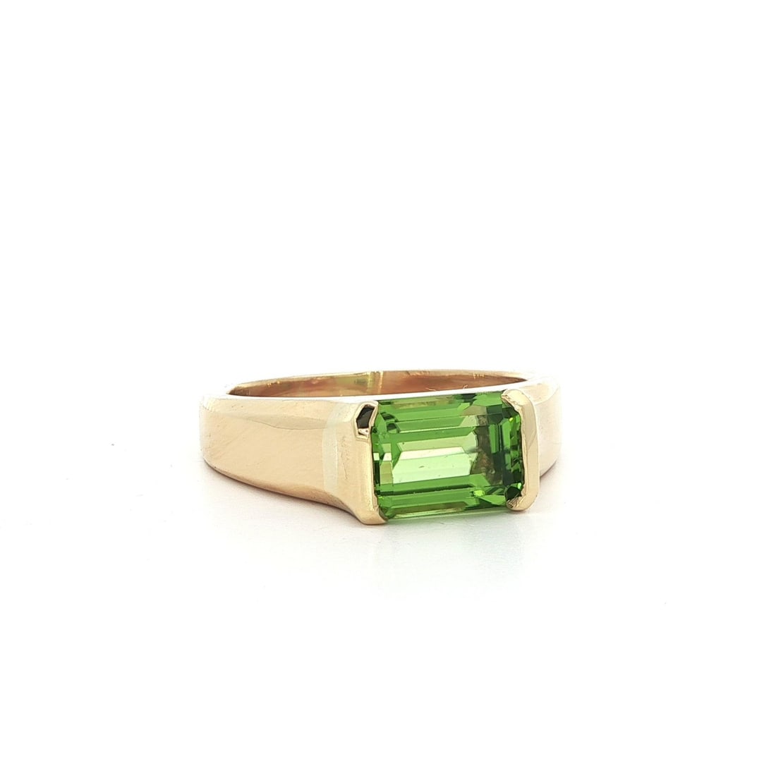 Natural Peridot Emerald Cut Yellow Gold Solitaire Ring Size 9.5: Natural Peridot Emerald Cut Yellow Gold Solitaire Ring Size 9.5 This stunning cocktail ring features a natural genuine peridot in an emerald cut, beautifully set in a half bezel design. The peridot ex