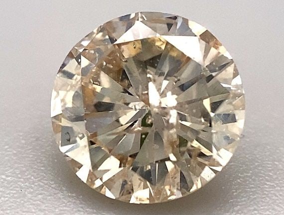 Loose Diamond - ROUND 1.5ct Champagne I1: Loose Diamond - ROUND 1.5ct Champagne I1 Source: Natural Shape: ROUND Carats: 1.5 Color: Champagne Certification: OTHER The Diamond Depot Guarantee: All items in this auction are guaranteed to be 100%