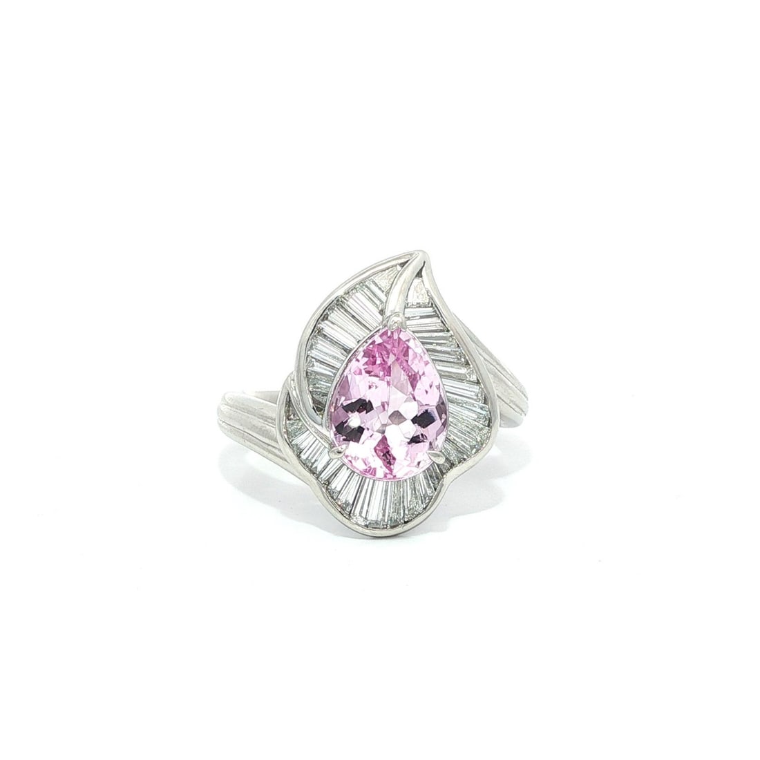 Platinum GIA 2.8ct Pear Cut Pink Topaz & Diamond Leaf Ring: Platinum GIA 2.8ct Pear Cut Pink Topaz & Diamond Leaf Ring This exquisite cocktail ring showcases a stunning pear-cut natural pink topaz, beautifully bezel set in solid platinum. The topaz, weighing 2